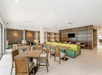 Spacious dining area with flat-screen TV.