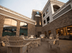 Relax in the courtyard with cozy seating and a warm fire pit for a perfect evening.