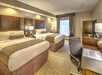 Enjoy a restful stay with two queen beds and a work desk.