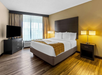 Relax in style with a king bed and a flat-screen TV for your entertainment.