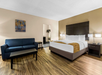 Enjoy the perfect blend of comfort with a king bed and a cozy sofa.