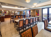 Spacious breakfast area with plenty  of breakfast options, indoor and outdoor seating with a view.