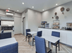 Breakfast area with modern furniture, and a selection of breakfast items.