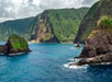 A view of mountainous formations seen from above the ocean on Big Island's Kohala Coast Adventure Helicopter Tour in Hawaii USA.