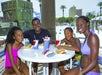 A family enjoying lunch in the shade at Big Kahuna's Water and Adventure Park in Destin, Fl. USA.