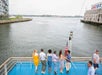 Guests enjoying the Boston views and their drinks at the deck