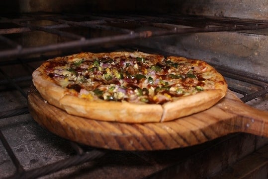 A pizza in the oven of North End Pizza Tour of Boston Pizza Tours