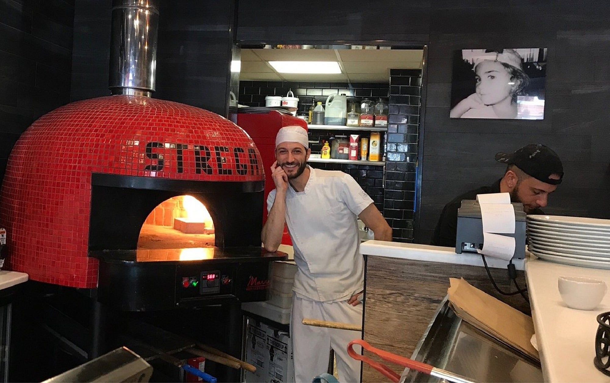 Chefs preparing fresh pies in a traditional North End kitchen.