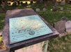 A view of pennies left on William Dawes Jr.'s headstone onThe Freedom Trail & North End North End Walking Tour in Boston Massachusetts.