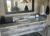 Guest bathroom with fresh towels and free toiletries. 