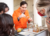 Docent sharing specimens within the Academy collection with guests.