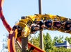A line of guests riding the RailBlazer on a sunny day at California's Great America in San Francisco, California.