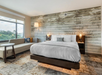 Guest room with a king bed and a seating area