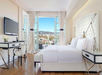 Relax in a king bed, complete with a balcony and work desk.