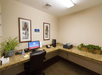 Business center equipped with a desktop computer and a printer.