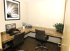 Business center equipped with a desktop computer and a printer.