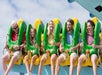 A family riding a Electro Spin and laughing at Carowinds in Charlotte, North Carolina.