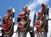 People riding a roller coaster on a sunny day at Carowinds in Charlotte, North Carolina.