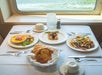 A table set for brunch in the Champagne Brunch Cruise Through Downtown Portland.
