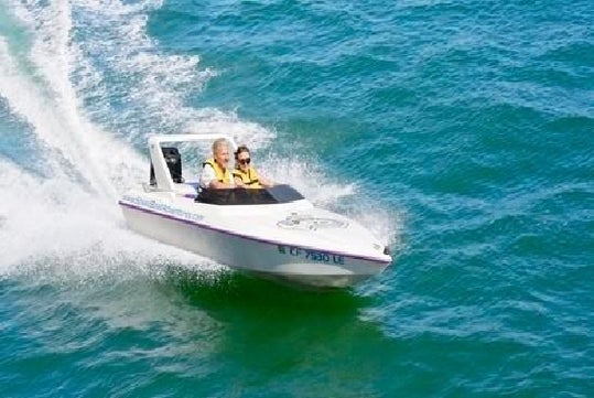 Two people speeding across the water in Charleston, South Carolina.jpg