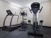 24-hour fitness center with cardio equipment.