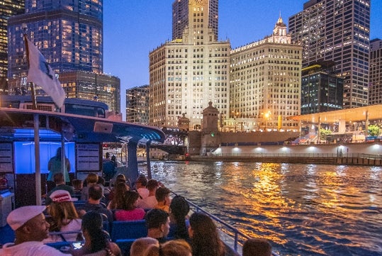 The lights of Chicago as seen from the Chicago by Night Cruise in Chicago Illinois.