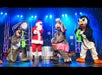 Characters and Santa Clause are dressed up for Christmas