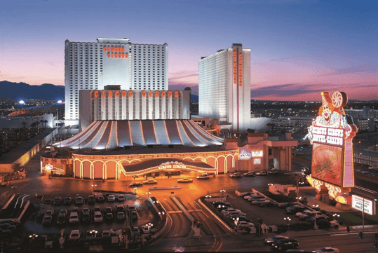 Hotel exterior at dusk.