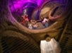 A group of people sit in a circular raft on a water ride inside a dimly lit tunnel with purple lighting above.