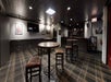 Bar/lounge with high top tables and chairs.