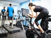 Fitness Center featuring Peloton Bike and treadmills.