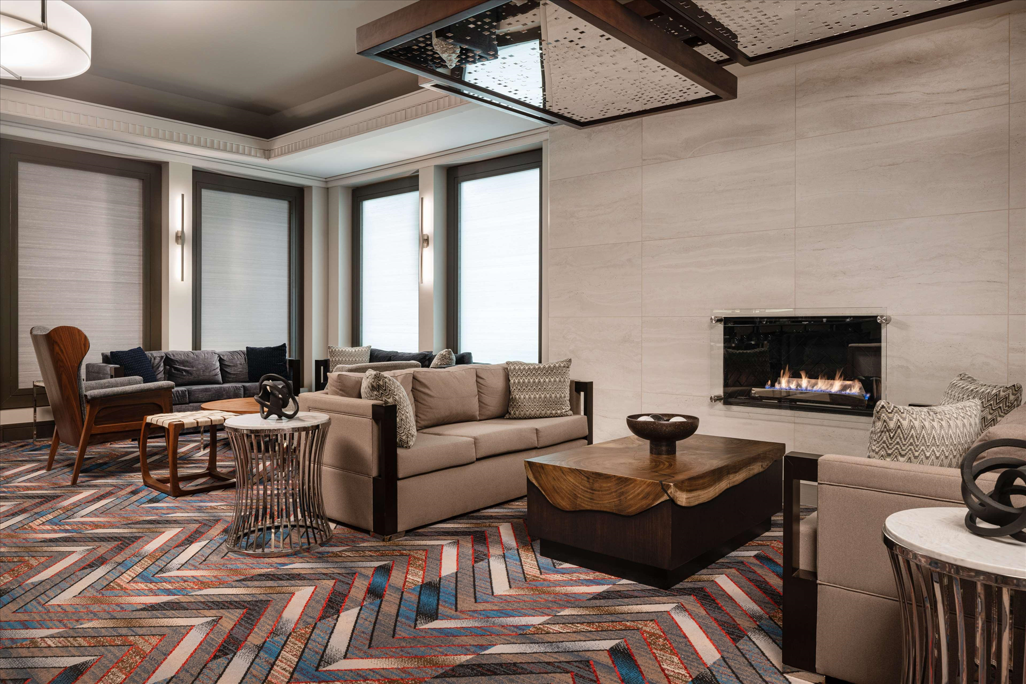 Lobby with seating area and fireplace.