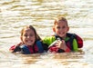 A brother and sister posing in the water for the camera on the Colorado River Full-Day Rafting Adventure in Moab Utah.