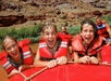 Some kids having a great time rafting down the Colorado River on the Colorado River Full-Day Rafting Adventure in Moab Utah.