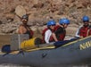 Guests are in awe of the Colorado River while riding their inflatable kayaks.