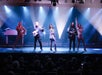 The cast of the Comedy Jamboree show performing on stage.