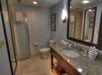Enjoy the convenience of a private bathroom featuring a spacious vanity area for your comfort.