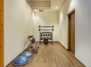 A weights area in the fitness center at the Comfort Inn Denver Central with a rack of free weights, a rack of kettle bells, and two balance trainers.