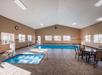 Indoor pool with seating.