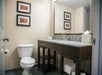 Guest bathroom with granite countertop.