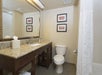 Guest bathroom with granite countertop.