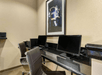 Business center equipped with two computers and a printer.