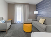 Unwind in the seating area with a comfortable plush sofa.