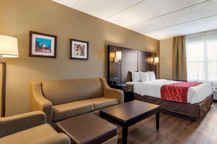 1 King bed, seating area, sofa bed at Comfort Inn & Suites near Six Flags, GA.