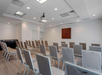 Meeting facility with a classroom setup.