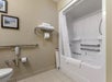 Guest bathroom with a combined shower and tub.