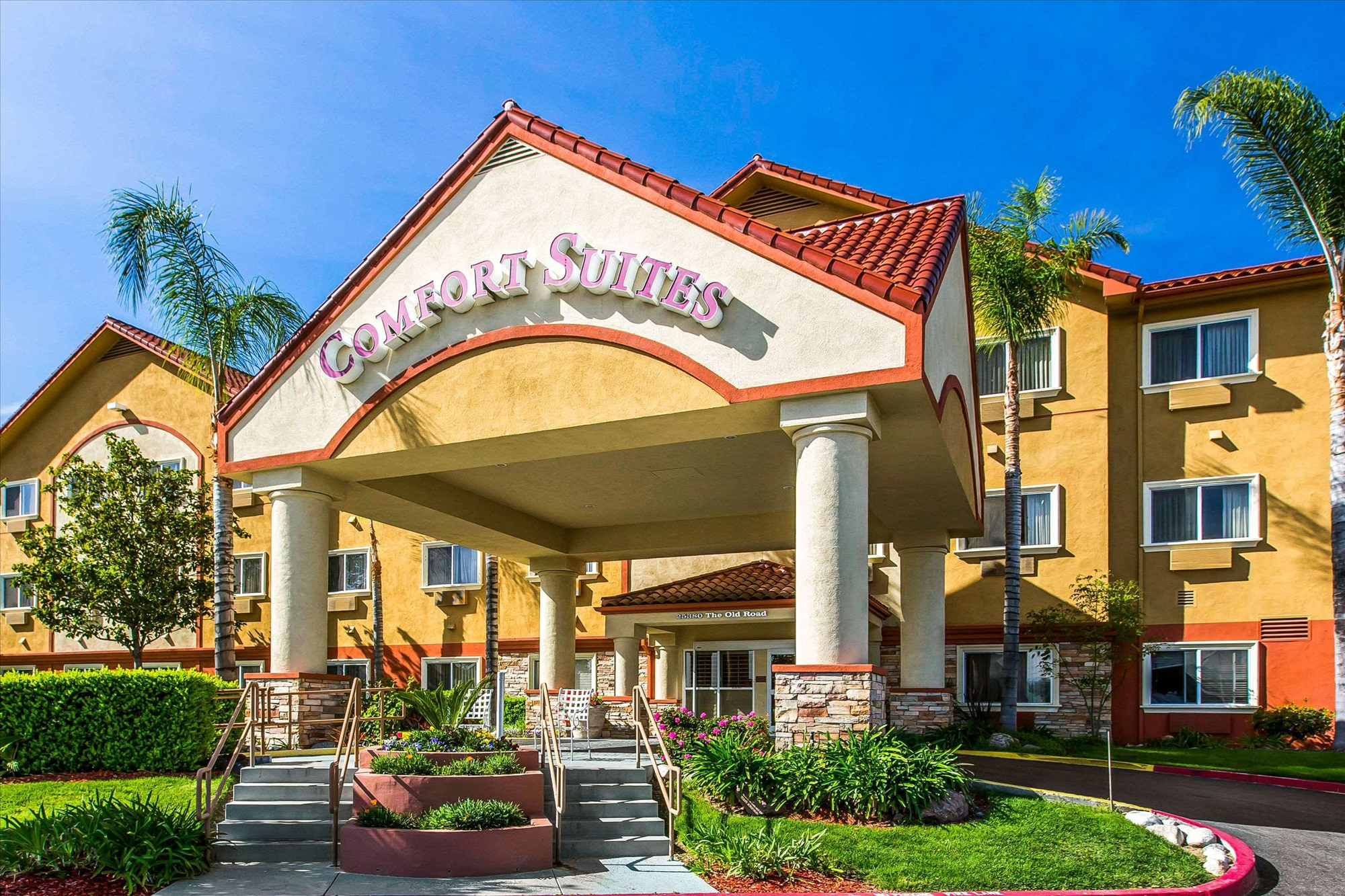 Beautifully landscaped hotel exterior.