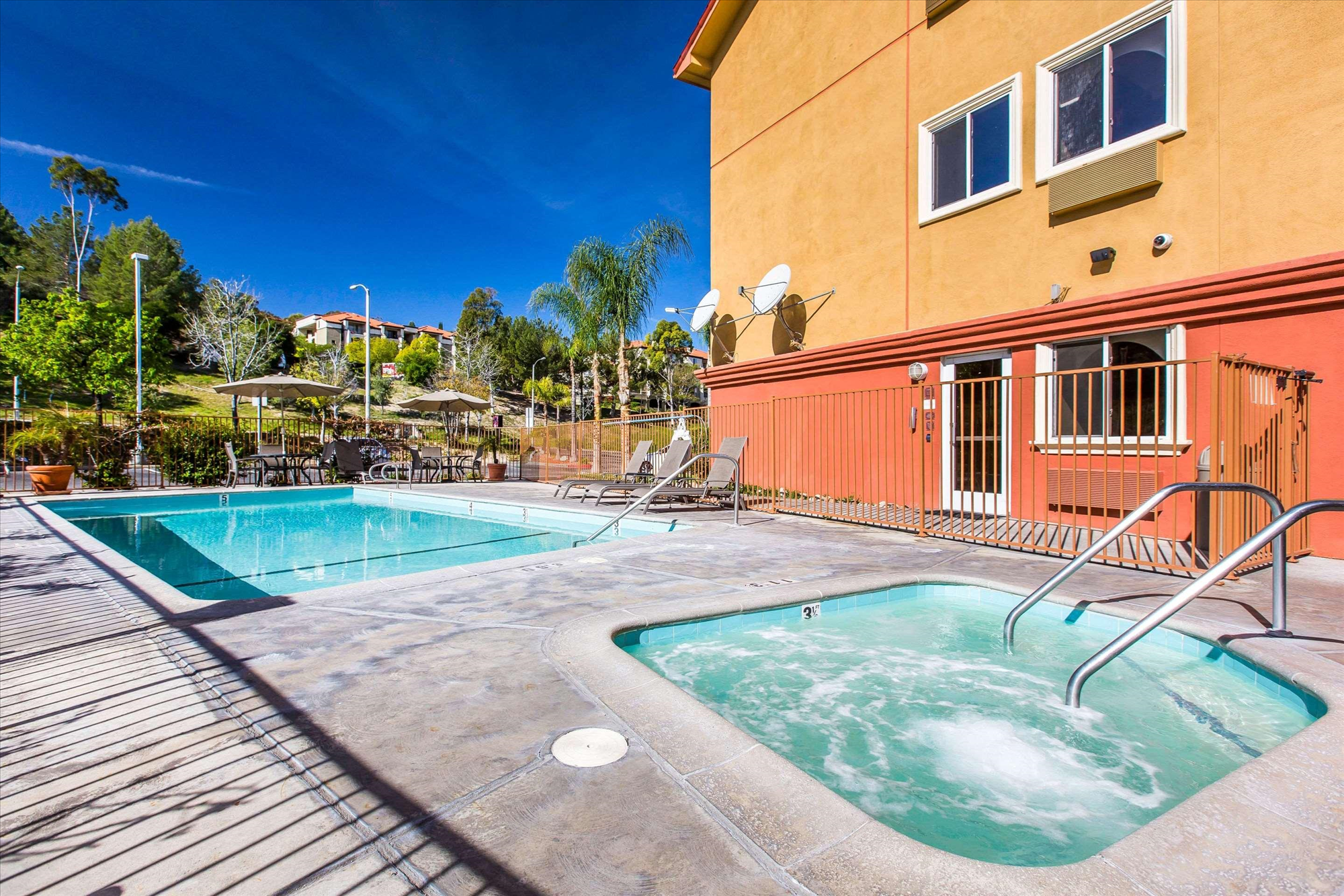 Refreshing outdoor pool and hot tub.