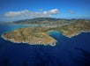 A view from above the ocean of several coves on the coast of Oahu island on the Complete Island Oahu Helicopter Tour in Hawaii USA.