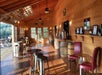 The interior of the Lumos Wine Co. with lots of barrels and seating options near Seattle, Washington.
